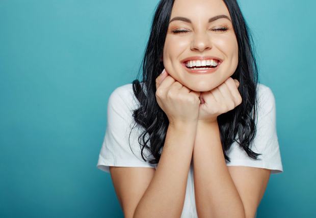 Smile examined with dental mirror