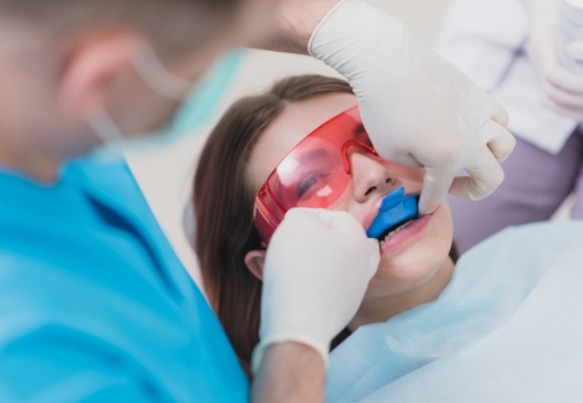 Dental patient receiving fluoride treatment