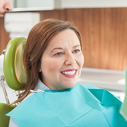 Woman smiling in the dental chair