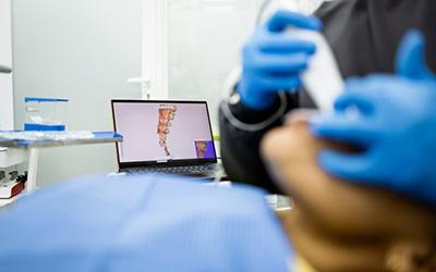 Dentist using an intraoral camera to capture digital impressions