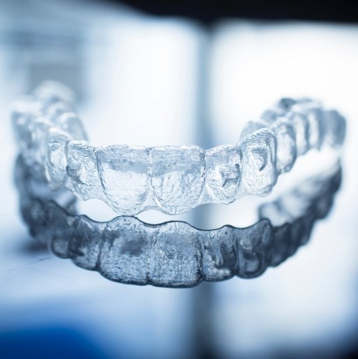 Invisalign clear braces tray laying on a flat surface