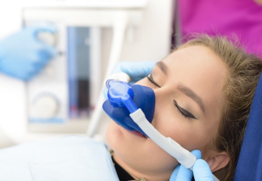 Woman receiving nitrous oxide dental sedation