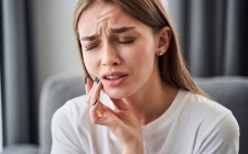 Woman in pain before emergency dentistry