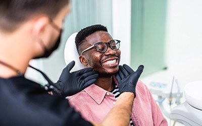Man smiling at the dentist
