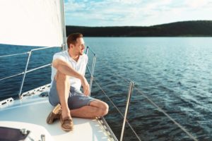 man smiling on a boat