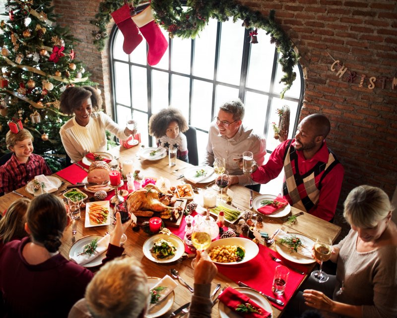 A family enjoying a holiday meal with good dental health
