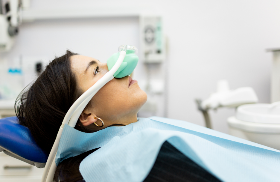 Woman with sedation mask on